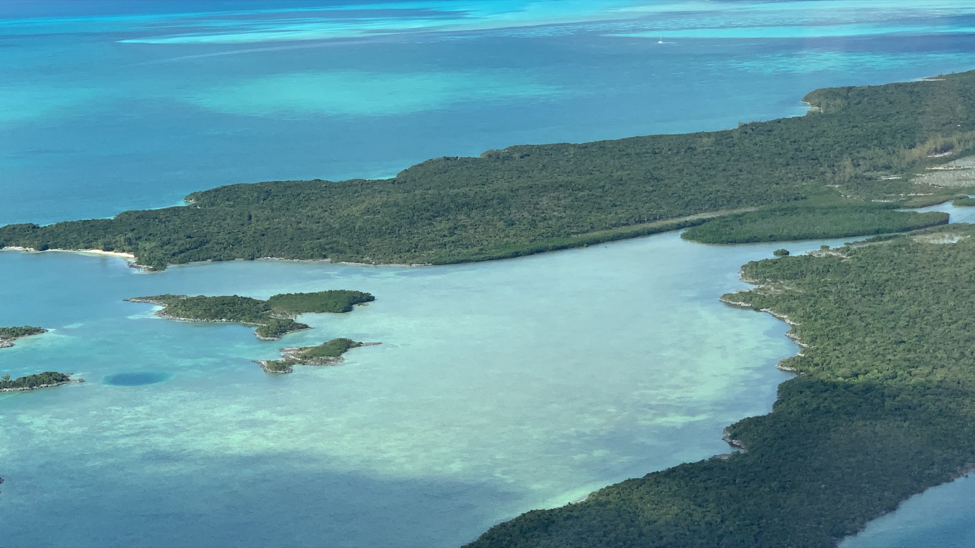 Tidal flats and blue hole on the western side